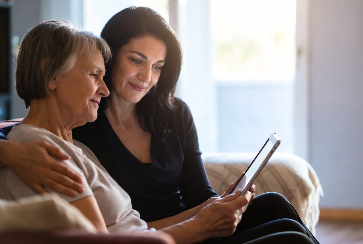 Family reviewing care plan together on a laptop